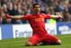 LIVERPOOL, ENGLAND - NOVEMBER 23: Luis Suarez of Liverpool celebrates scoring his team's second goal during the Barclays Premier League match between Everton and Liverpool at Goodison Park on November 23, 2013 in Liverpool, England. (Photo by Alex Livesey/Getty Images)
