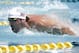 Michael Phelps competes in the 100-meter butterfly during the Arena Grand Prix swim meet, Thursday, April 24, 2014, in Mesa, Ariz. It is Phelps' first competitive event after a nearly two-year retirement. (AP Photo/Matt York)