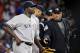 Home plate umpire Gerry Davis ejects New York Yankees starting pitcher Michael Pineda after a foreign substance was discovered on his neck in the second inning of a baseball game against the Boston Red Sox at Fenway Park in Boston, Wednesday, April 23, 2014. (AP Photo/Elise Amendola)