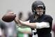 Texas A&M quarterback Johnny Manziel passes the ball during a drill at pro day for NFL football representatives in College Station, Texas, Thursday, March 27, 2014. (AP Photo/Patric Schneider)