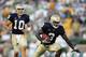 SOUTH BEND, IN - SEPTEMBER 17: Darius Walker #3 takes the handoff from Brady Quinn #10 of the Notre Dame Fighting Irish during the game with the Michigan State Spartans on September 17, 2005 at Notre Dame Stadium in South Bend, Indiana. The Spartans defeated the Irish 44-41 in overtime. (Photo by Elsa/Getty Images)