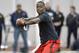 Louisville quarterback Teddy Bridgewater participates in a passing drill for NFL representatives during pro day at the University of Louisville in Louisville, Ky., Monday, March 17, 2014. (AP Photo/Timothy D. Easley)