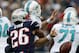 New England Patriots defensive back Logan Ryan, left, strips the ball from Miami Dolphins quarterback Ryan Tannehill (17) in the third quarter of an NFL football game Sunday, Oct. 27, 2013, in Foxborough, Mass. (AP Photo/Michael Dwyer)