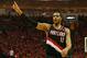 HOUSTON, TX - APRIL 23: LaMarcus Aldridge #12 of the Portland Trail Blazers celebrates a play on the court in the second half of the game against the Houston Rockets in Game Two of the Western Conference Quarterfinals during the 2014 NBA Playoffs at Toyota Center on April 23, 2014 in Houston, Texas. NOTE TO USER: User expressly acknowledges and agrees that, by downloading and or using this photograph, User is consenting to the terms and conditions of the Getty Images License Agreement. (Photo by Scott Halleran/Getty Images)
