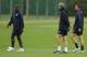 LONDON, ENGLAND - SEPTEMBER 14: Arsenal's Manager Arsene Wenger speaks to Bacary Sagna during a training session ahead of the UEFA Champions League game against Braga at the club's complex in London Colney on September 14, 2010 in London, England. (Photo by Ian Walton/Getty Images)