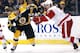 Boston Bruins' Jarome Iginla (12) tries to get past Detroit Red Wings' Brendan Smith during the second period of a first-round NHL playoff hockey game in Boston Friday, April 18, 2014. (AP Photo/Winslow Townson)