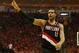 HOUSTON, TX - APRIL 23: LaMarcus Aldridge #12 of the Portland Trail Blazers celebrates a play on the court in the second half of the game against the Houston Rockets in Game Two of the Western Conference Quarterfinals during the 2014 NBA Playoffs at Toyota Center on April 23, 2014 in Houston, Texas. NOTE TO USER: User expressly acknowledges and agrees that, by downloading and or using this photograph, User is consenting to the terms and conditions of the Getty Images License Agreement. (Photo by Scott Halleran/Getty Images)
