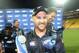 New Zealand's captain Brendon McCullum holds the trophy as his teammates celebrate after their series' victory over India during the fifth one day International cricket match at Westpac Stadium in Wellington, New Zealand, Friday, Jan. 31, 2014. (AP Photo/SNPA, Ross Setford) NEW ZEALAND OUT