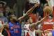Chicago Bulls guard D.J. Augustin, right, shoots against Detroit Pistons forward Greg Monroe during the first half of an NBA basketball game in Chicago on Friday, April 11, 2014. (AP Photo/Nam Y. Huh)