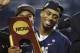 Connecticut guard Ryan Boatright holds the championship trophy after his team beat Kentucky 60-54, at the NCAA Final Four tournament college basketball championship game Monday, April 7, 2014, in Arlington, Texas. (AP Photo/David J. Phillip)