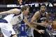 San Antonio Spurs forward Tim Duncan (21) drives against Dallas Mavericks forward Dirk Nowitzki (41) during the first half an NBA basketball game Thursday, April 10, 2014, in Dallas. (AP Photo/LM Otero)