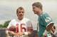 San Francisco 49ers' quarterback Joe Montana, left and Miami Dolphins quarterback Dan Marino chat during a training session at Crystal Palace, July 26, 1988, in London. Their teams meet in a match at Wembley Stadium on July 31. (AP Photo/Doug Jennings)