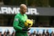 Everton's goalkeeper Tim Howard holds the ball during the English Premier League soccer match between Tottenham Hotspur and Everton at the White Hart Lane stadium in London, Sunday, Feb. 9, 2014. (AP Photo/Alastair Grant)