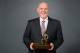 DENVER, CO - MAY 8: Head Coach George Karl of the Denver Nuggets poses for a photo with the Red Auerbach Trophy after being named 2012-2013 NBA Coach of the Year on May 8, 2013 at the Pepsi Center in Denver, Colorado. NOTE TO USER: User expressly acknowledges and agrees that, by downloading and/or using this Photograph, user is consenting to the terms and conditions of the Getty Images License Agreement. Mandatory Copyright Notice: Copyright 2013 NBAE (Photo by Garrett W. Ellwood/NBAE via Getty Images)
