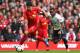 LIVERPOOL, ENGLAND - MARCH 30: Luis Suarez of Liverpool competes with Danny Rose of Tottenham Hotspur during the Barclays Premier League match between Liverpool and Tottenham Hotspur at Anfield on March 30, 2014 in Liverpool, England. (Photo by Alex Livesey/Getty Images)
