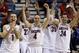 Arizona players, including Gabe York (1), T.J. McConnell (4) and Elliott Pitts (24), react to a 3-point basket late in the second half of an NCAA college basketball game against Utah in the quarterfinals of the Pac-12 Conference tournament, Thursday, March 13, 2014, in Las Vegas. Arizona won 71-39. (AP Photo/Julie Jacobson)