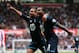 STOKE ON TRENT, ENGLAND - APRIL 26: Danny Rose of Tottenham Hotspur celebrates with Aaron Lennon after scoring the opening goal during the Barclays Premier League match between Stoke City and Tottenham Hotspur at the Britannia Stadium on April 26, 2014 in Stoke on Trent, England. (Photo by Alex Livesey/Getty Images)