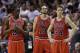 Chicago Bulls' Tony Snell (20), Joakim Noah (13) and Mike Dunleavy (34) stand on the court during a time out in the second half of an NBA basketball gam against the Miami Heate, Sunday, Feb. 23, 2014, in Miami. The Heat defeated the Bulls 93-79. (AP Photo/Lynne Sladky)