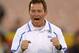 UCLA head coach Jim Mora cheers his team on during warmups prior to an NCAA college football game against Southern California, Saturday, Nov. 30, 2013, in Los Angeles. (AP Photo/Mark J. Terrill)