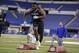 Delaware defensive lineman Zach Kerr runs a drill at the NFL football scouting combine in Indianapolis, Monday, Feb. 24, 2014. (AP Photo/Michael Conroy)