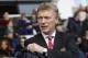 Manchester United's manager David Moyes looks on from the dugout before the start of their English Premier League soccer match against Tottenham Hotspur at White Hart Lane, London, Sunday, Dec. 1, 2013. (AP Photo/Sang Tan)