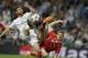 Real's Xabi Alonso, left, and Bayern's Thomas Mueller challenge for the ball during a Champions League semifinal first leg soccer match between Real Madrid and Bayern Munich at the Santiago Bernabeu stadium in Madrid, Spain, Wednesday, April 23, 2014 .(AP Photo/Paul White)