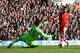 LONDON, ENGLAND - MARCH 23: Adam Lallana of Southampton scores his team's second goal past Hugo Lloris of Tottenham Hotspur during the Barclays Premier League match between Tottenham Hotspur and Southampton at White Hart Lane on March 23, 2014 in London, England. (Photo by Clive Rose/Getty Images)