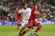 Real's Xabi Alonso stops Bayern's Arjen Robben, right, during a Champions League semifinal first leg soccer match between Real Madrid and Bayern Munich at the Santiago Bernabeu stadium in Madrid, Spain, Wednesday, April 23, 2014. (AP Photo/Paul White)