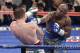 Floyd Mayweather Jr. throws a punch against Canelo Alvarez during a 152-pound title fight, Saturday, Sept. 14, 2013, in Las Vegas. (AP Photo/Isaac Brekken)