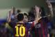 Barcelona's Lionel Messia, left, and Cesc Fabregas, center, celebrates after their team scored a goal during a Spanish La Liga soccer match at the Madrigal stadium in Villarreal, Spain, on Sunday, April 27, 2014. (AP Photo/Alberto Saiz)