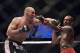 Apr 26, 2014; Baltimore, MD, USA; Jon Jones and Glover Teixeira exchange punches during the UFC light heavy weight championship fight at Baltimore Arena. Jones retained the light heavy height championship by defeating Teixeria. Mandatory Credit: Tommy Gilligan-USA TODAY Sports