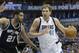 Dallas Mavericks forward Dirk Nowitzki (41) of Germany drives against San Antonio Spurs forward Tim Duncan (21) during the first half of Game 3 of an NBA basketball first-round playoff series in Dallas, Saturday, April 26, 2014. (AP Photo/LM Otero)