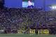 Players stand for a minute of silence for former Barcelona coach Tito Vilanova before a La Liga soccer match between Villarreal and Barcelona in Villarreal on Sunday, April 27, 2014. Vilanova, the coach who succeeded Pep Guardiola at Barcelona and won the Spanish league title in his only season in charge, died Friday following a long battle with throat cancer. He was 45.(AP Photo/Alberto Saiz)