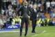Bayern head coach Pep Guardiola, left, watches the Champions League semifinal first leg soccer match between Real Madrid and Bayern Munich at the Santiago Bernabeu stadium in Madrid, Spain, Wednesday, April 23, 2014. (AP Photo/Paul White)