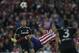 Atletico's Diego Costa, center, tries to controls the ball during the Champions League semifinal first leg soccer match between Atletico Madrid and Chelsea at the Vicente Calderon stadium in Madrid, Spain, Tuesday, April 22, 2014. (AP Photo/Gabriel Pecot)