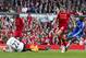 Chelsea's Demba Ba, right, scores past Liverpool goalkeeper Simon Mignolet, below, after an error by captain Steven Gerrard, second right, during their English Premier League soccer match at Anfield Stadium, Liverpool, England, Sunday April 27, 2014. (AP Photo/Jon Super)