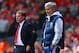 LIVERPOOL, ENGLAND - APRIL 27: Manager Brendan Rodgers of Liverpool and Jose Mourinho manager of Chelsea look on from the touchline during the Barclays Premier League match between Liverpool and Chelsea at Anfield on April 27, 2014 in Liverpool, England. (Photo by Clive Brunskill/Getty Images)