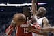 Houston Rockets center Dwight Howard, left, looks for an opening against Portland Trail Blazers forward Nicolas Batum during the first half of Game 3 of an NBA basketball first-round playoff series in Portland, Ore., Friday, April 25, 2014. (AP Photo/Don Ryan)