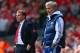 LIVERPOOL, ENGLAND - APRIL 27: Manager Brendan Rodgers of Liverpool and Jose Mourinho manager of Chelsea look on from the touchline during the Barclays Premier League match between Liverpool and Chelsea at Anfield on April 27, 2014 in Liverpool, England. (Photo by Clive Brunskill/Getty Images)