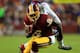 LANDOVER, MD - DECEMBER 01: Josh Morgan #15 of the Washington Redskins runs the ball against Jayron Hosley #28 of the New York Giants in the first quarter during their game at FedExField on December 1, 2013 in Landover, Maryland. (Photo by Rob Carr/Getty Images)