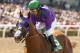 In a photo provided by Benoit Photo, California Chrome and jockey Victor Espinoza win the Santa Anita Derby horse race Saturday, April 5, 2014, at Santa Anita in Arcadia, Calif. (AP Photo/Benoit Photo)