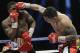 Marcos Rene Maidana, right, lands a punch on Adrien Broner, left, during an WBA welterweight title bout, Saturday, Dec. 14, 2013, in San Antonio. (AP Photo/Eric Gay)