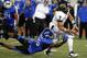 Kent State's David Fisher (7) is stopped by Buffalo's Khalil Mack (46) during the second half of an NCAA college football game in Amherst, N.Y., Wednesday, Sept. 19, 2012. Kent State won 23-7. (AP Photo/Bill Wippert)