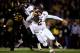 COLUMBIA, MO - NOVEMBER 30: Quarterback Johnny Manziel #2 of the Texas A&M Aggies scrambles as defensive lineman Markus Golden #33 of the Missouri Tigers persues during the game on November 30, 2013 in Columbia, Missouri. (Photo by Jamie Squire/Getty Images)