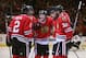 CHICAGO, IL - APRIL 27: (L-R) Duncan Keith #2, Brandon Saad #20, Andrew Shaw #65, Marcus Kruger #16 and Michal Rozsival #32 of the Chicago Blackhawks celebrate a third period goal by Shaw against the St. Louis Blues in Game Six of the First Round of the 2014 NHL Stanley Cup Playoffs at the United Center on April 27, 2014 in Chicago, Illinois. The Blackhawks defeated the Blues 5-1 to win the series four games to two. (Photo by Jonathan Daniel/Getty Images)
