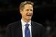 HOUSTON, TX - APRIL 04: Broadcaster Steve Kerr smiles on the court before the National Championship Game of the 2011 NCAA Division I Men's Basketball Tournament between the Butler Bulldogs and Connecticut Huskies at Reliant Stadium on April 4, 2011 in Houston, Texas. (Photo by Streeter Lecka/Getty Images)