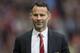 Manchester United's interim manager Ryan Giggs smiles as he takes to the touchline before his team's English Premier League soccer match against Norwich City at Old Trafford Stadium, Manchester, England, Saturday April 26, 2014. (AP Photo/Jon Super)