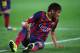 BARCELONA, SPAIN - APRIL 01: Neymar of Barcelona grimaces as he goes to ground during the UEFA Champions League Quarter Final first leg match between FC Barcelona and Club Atletico de Madrid at Camp Nou on April 1, 2014 in Barcelona, Spain. (Photo by Clive Rose/Getty Images)