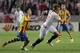 Sevilla's Ivan Rakitic, right, and Valencia's Javi Fuego, left, vie for the ball during their Europa League semifinal first leg soccer match at the Ramon Sanchez Pizjuan stadium, in Seville, Spain on Thursday, April 24, 2014. (AP Photo/Miguel Angel Morenatti)