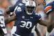 Auburn defensive end Dee Ford (30) celebrates in the first half of an NCAA college football game against Mississippi State in Auburn, Ala., Saturday, Sept. 14, 2013. (AP Photo/Dave Martin)